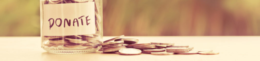 a donation jar filled with coins